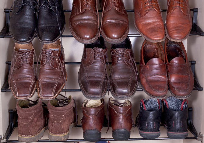 Extra large and wide high top and low top dress shoes on rack